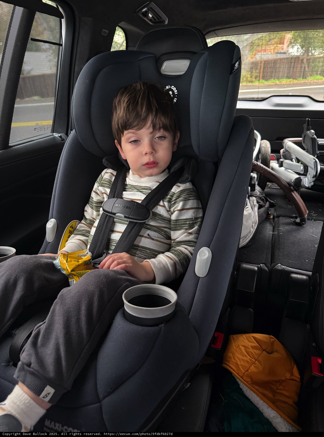Young Child in Car Seat During Winter Journey