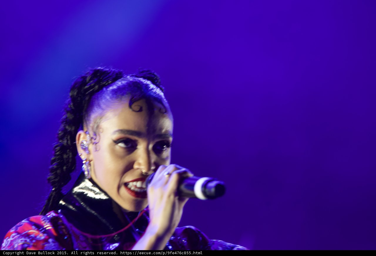 FKA twigs Expressive Close-Up Portrait Slight Smile Baby Hairs Elaborate Swirls Cat-Eye Makeup Hoop Earrings Septum Ring Red Lipstick Black Choker Braided Ponytails Kimono Purple Blue Lighting