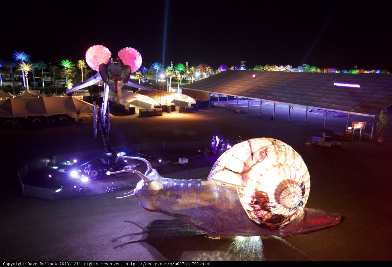 Illuminated Snail Sculpture in the Night Sky