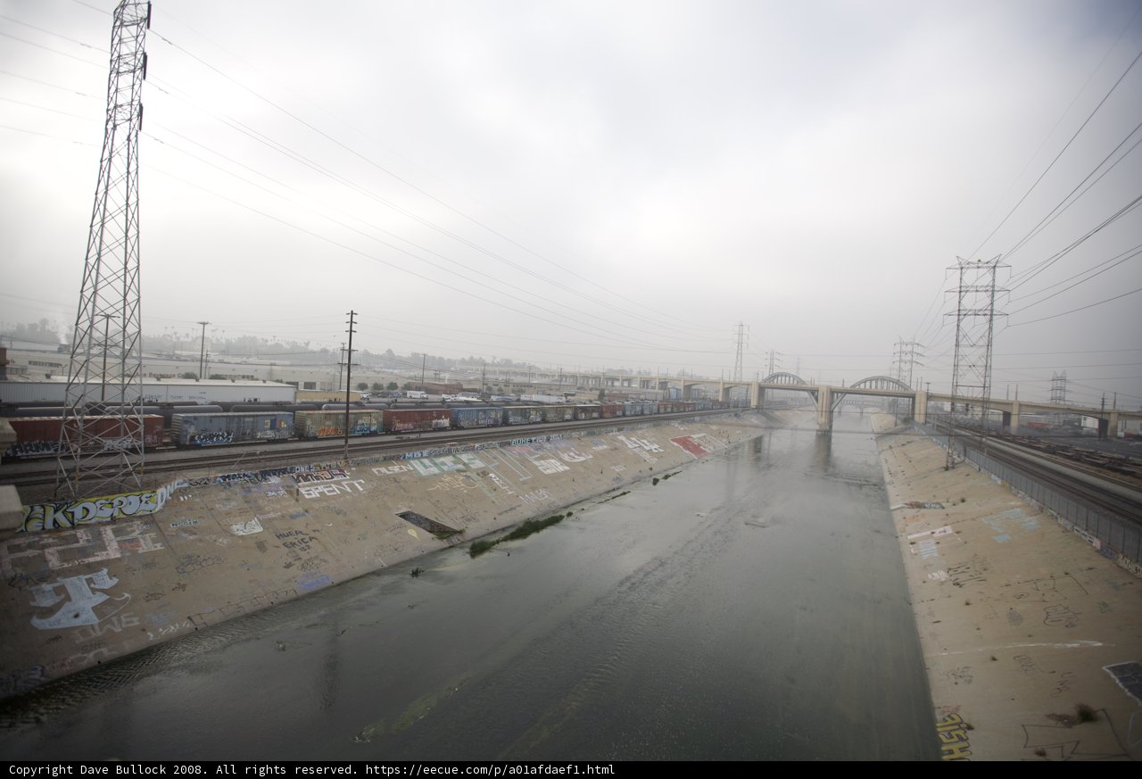 Graffiti-clad River with Train