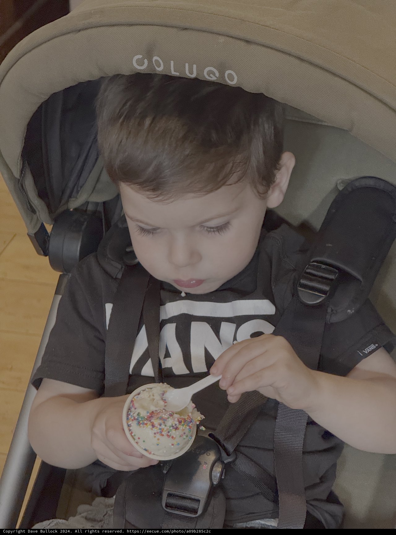 Toddler Enjoying Cupcake in Stroller
