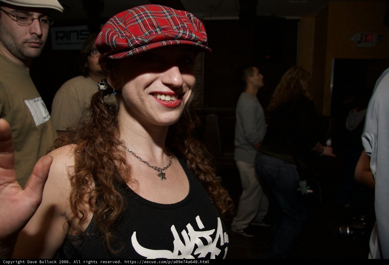 Two-Hatted Urban Woman at the Pub