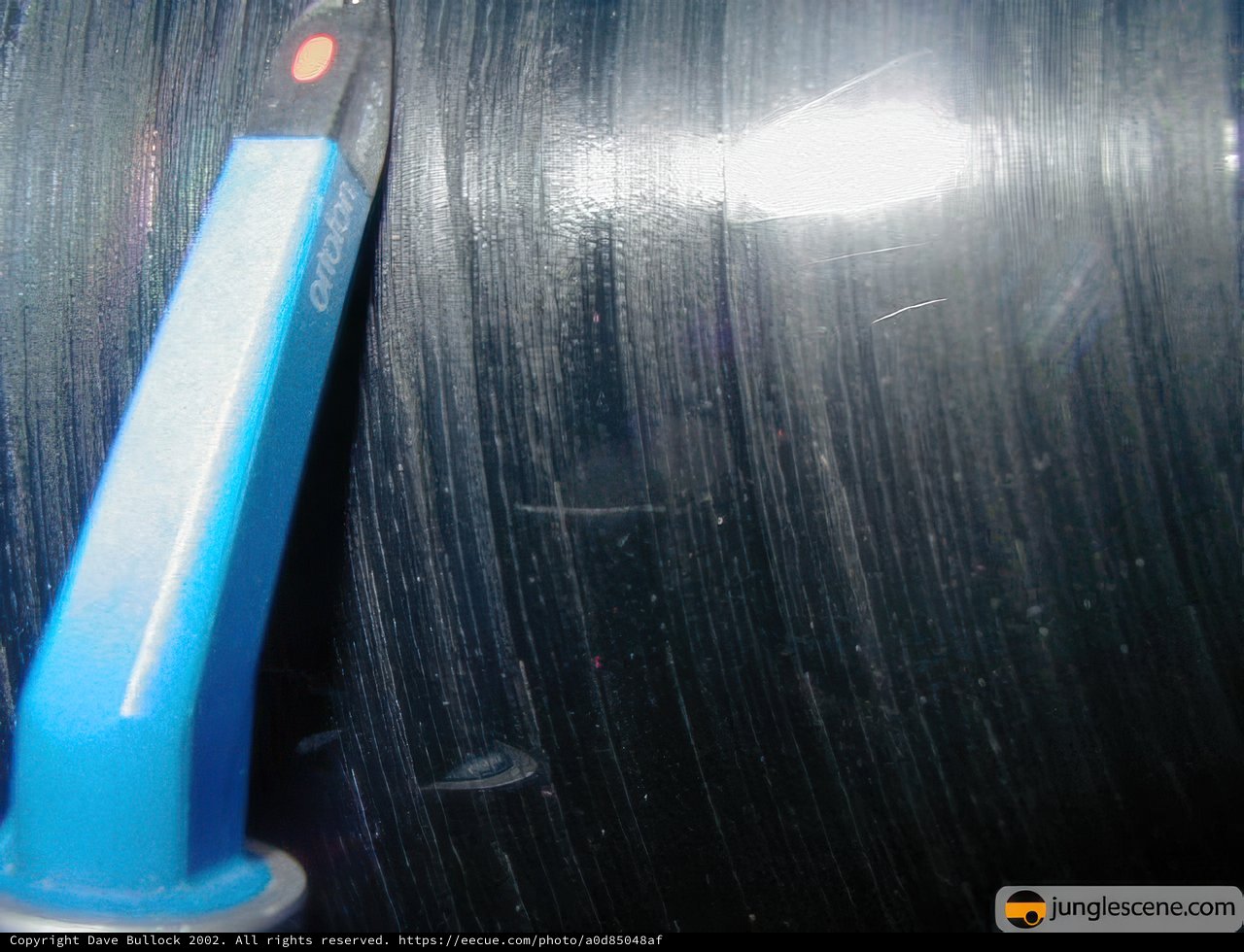 Holding a Blue and White Brush with a Metal Pole