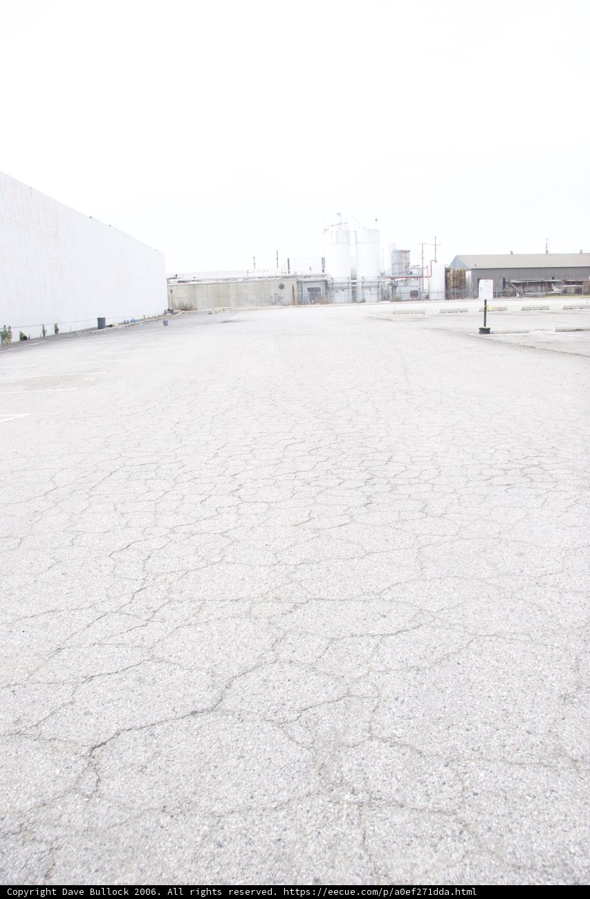 Parking Lot with White Building