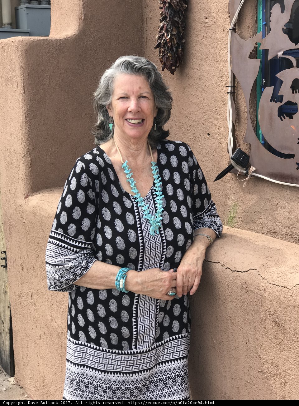 Rhoda B Stands Proudly with Her Art