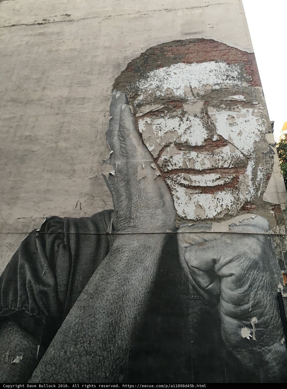 The Mural of a Bearded Man with his Hand on his Face