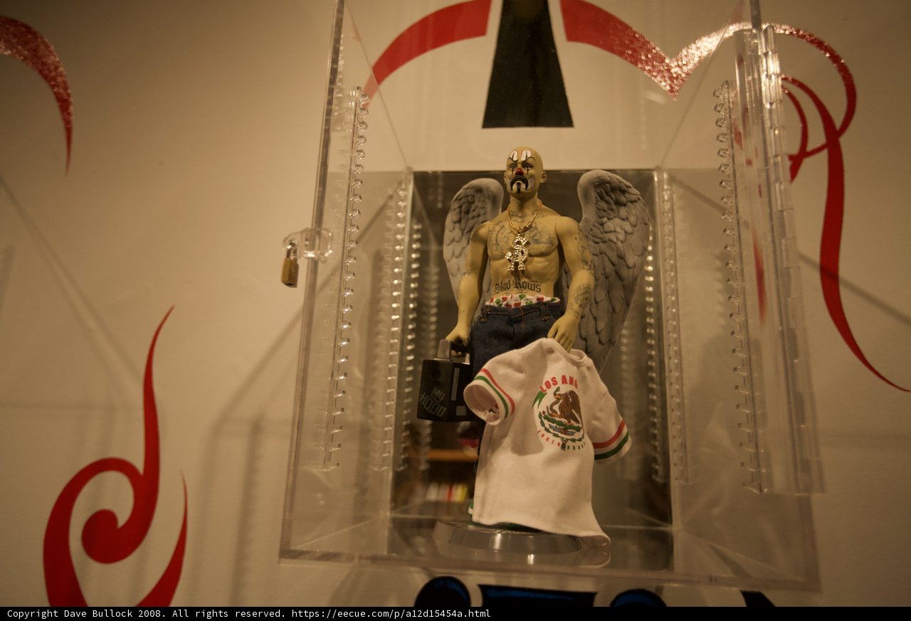 Statue of a Man with a T-Shirt in a Glass Case