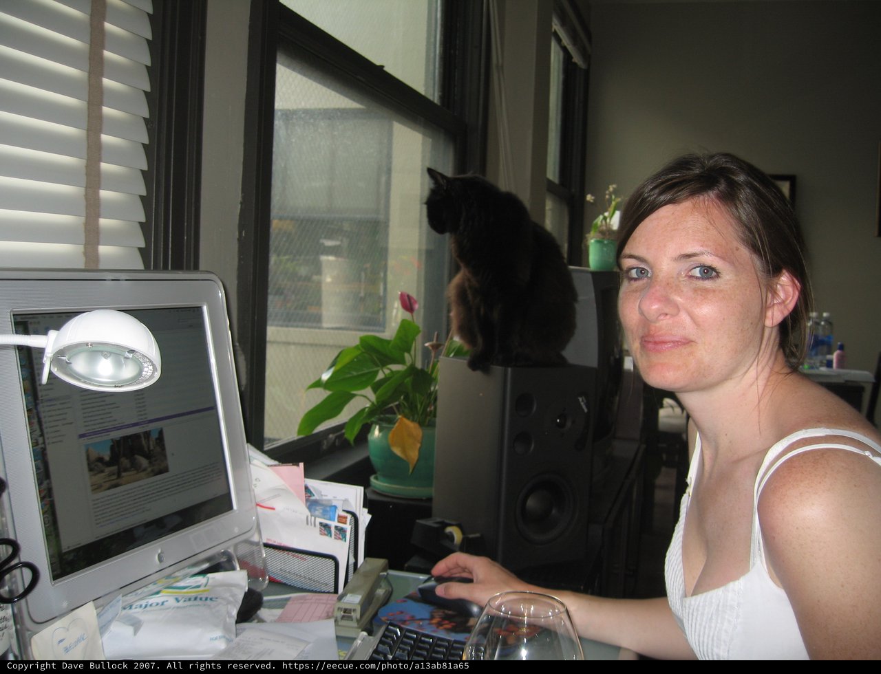 Penelope at Her Desk With Black Cat Companion