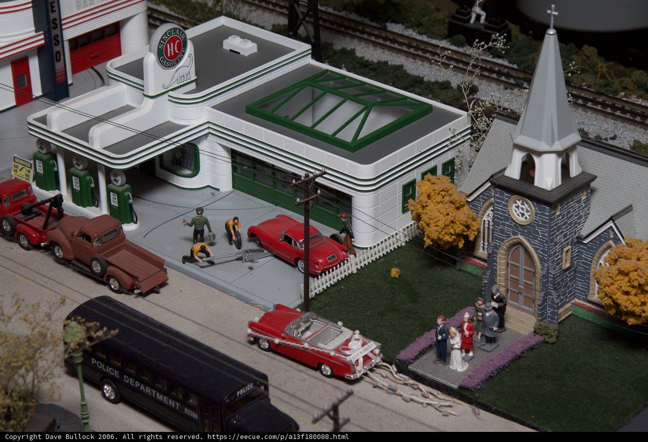 Gas Station adjacent to a Church and a Bus