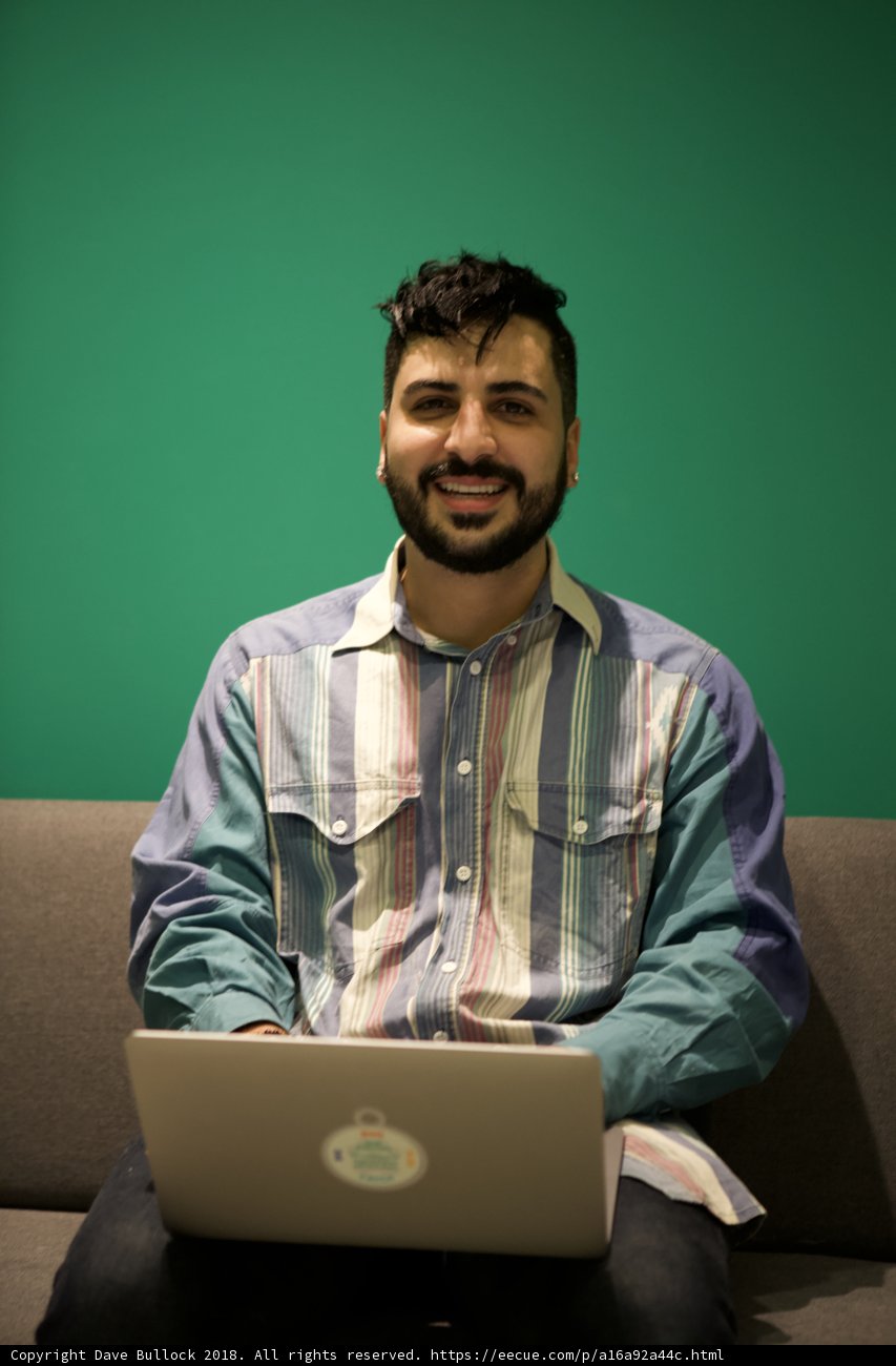 Happy man working on laptop
