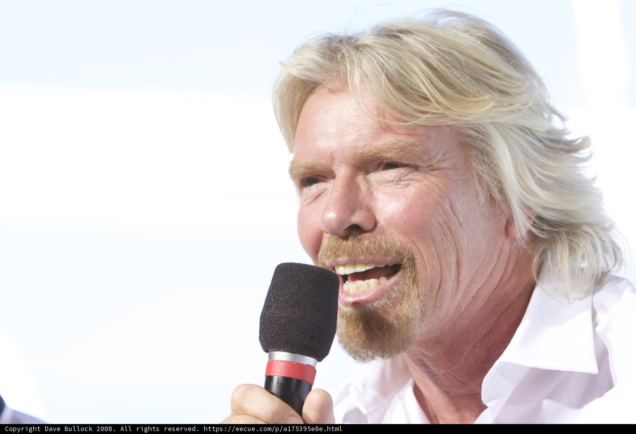Richard Branson Takes the Stage with a Microphone