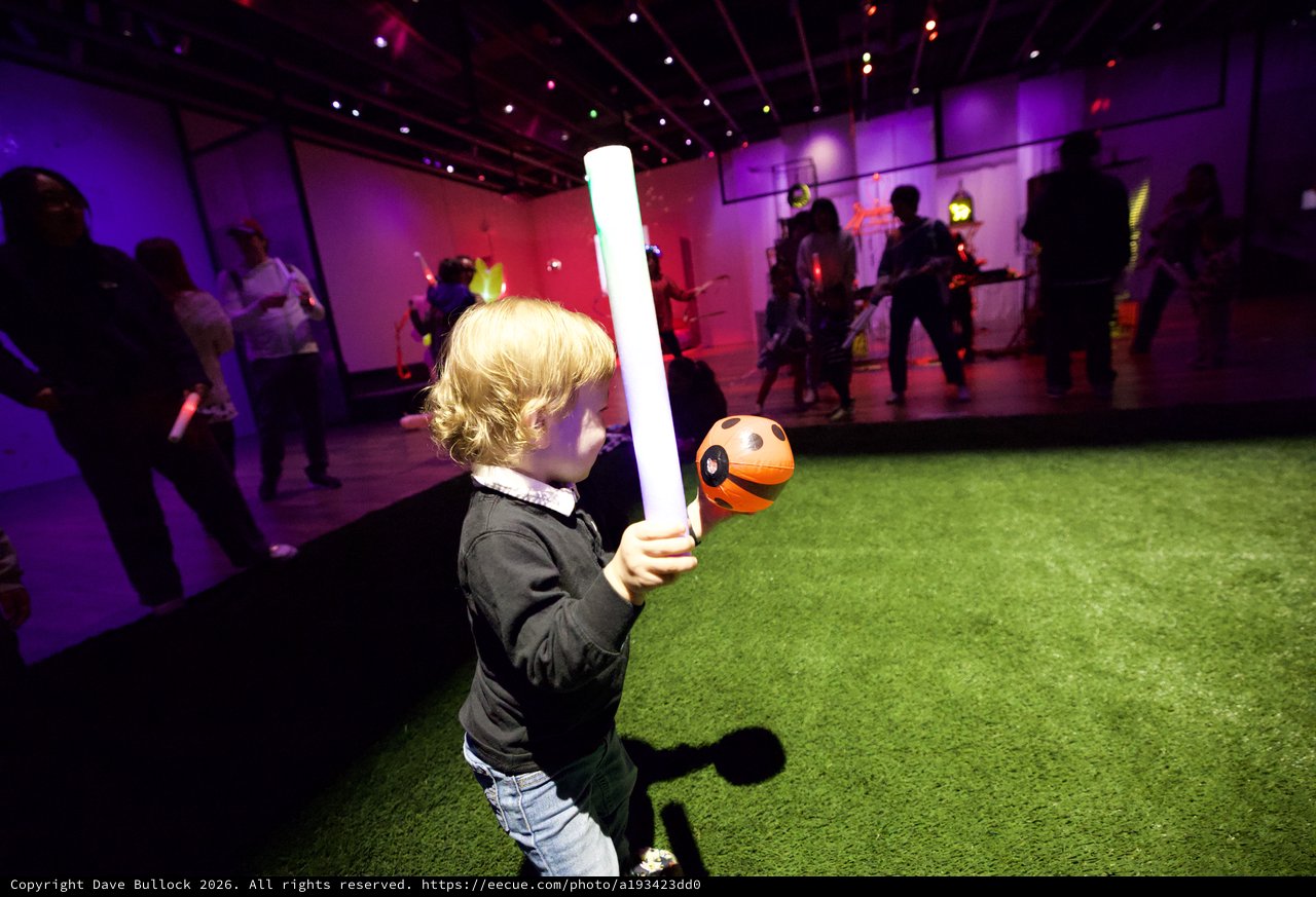 Child with Lightsaber at Baby Rave Event