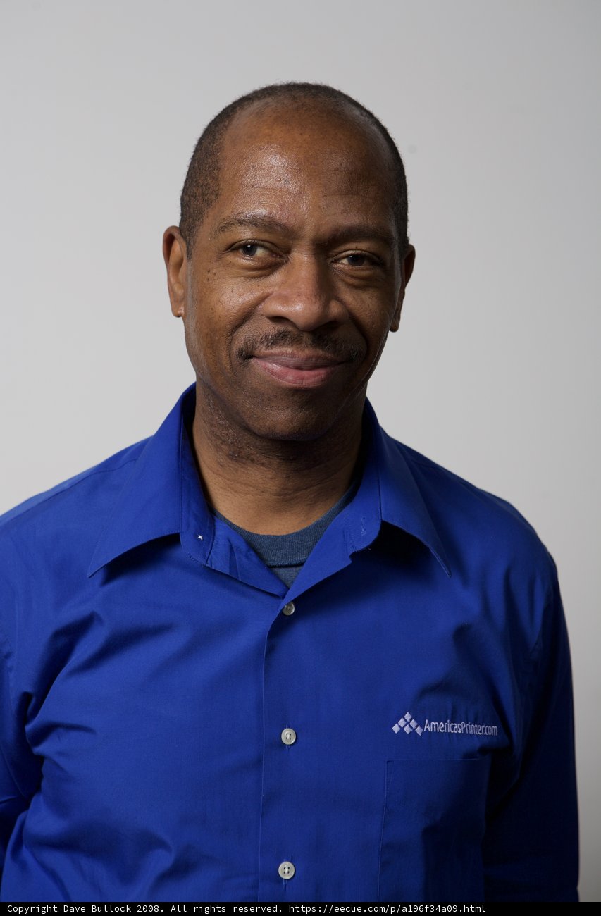 A Happy Black Man in a Blue Dress Shirt