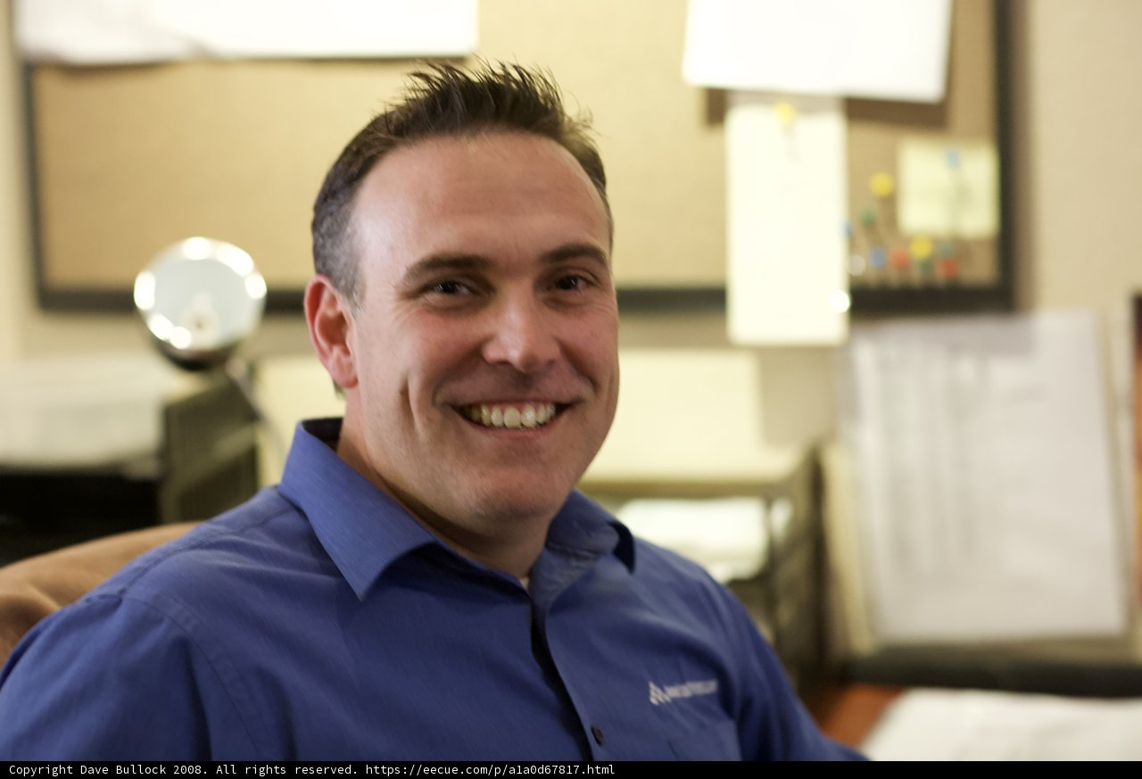 Happy man in a blue shirt