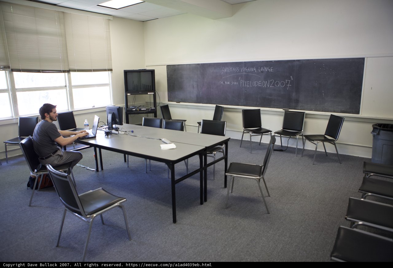 A Man at the Chalkboard Table