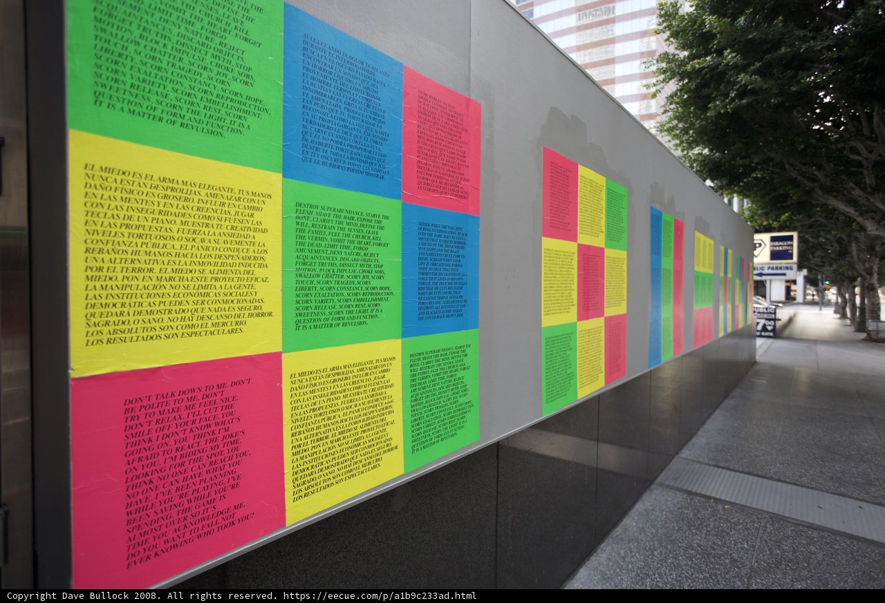 Advertisements and Posters on a Colorful Wall