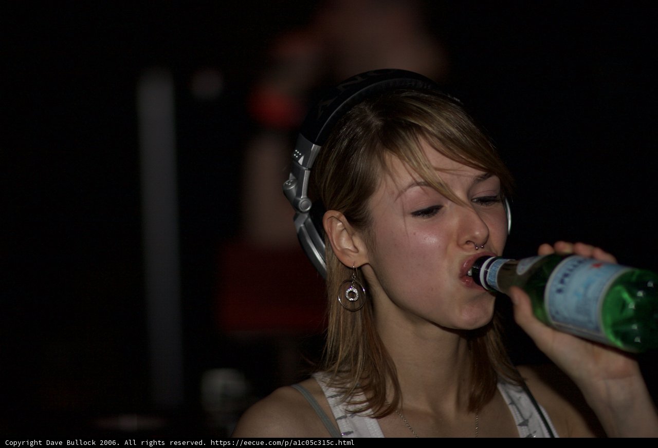 DJ Reid Speed performing with a bottle in hand