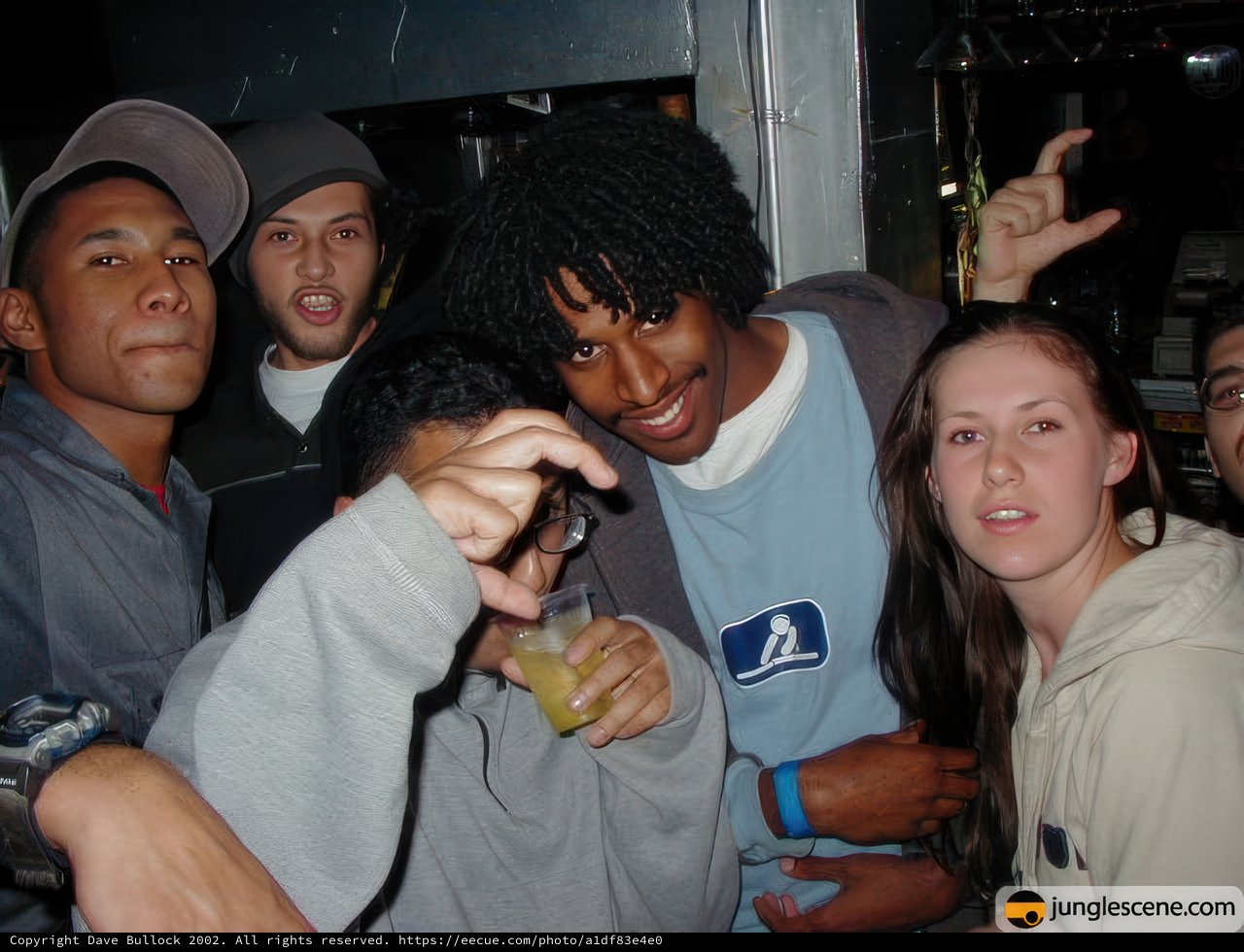 Group Poses for Photo at Night Club