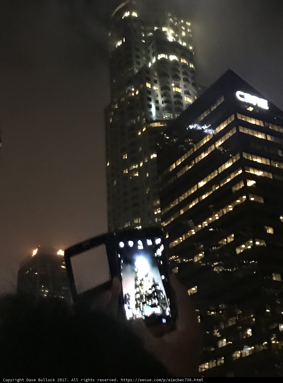 Nighttime Cityscape of Two Towers