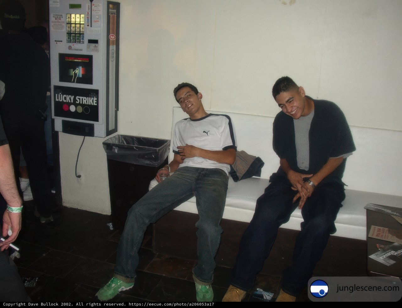 Two men taking a break on a bench