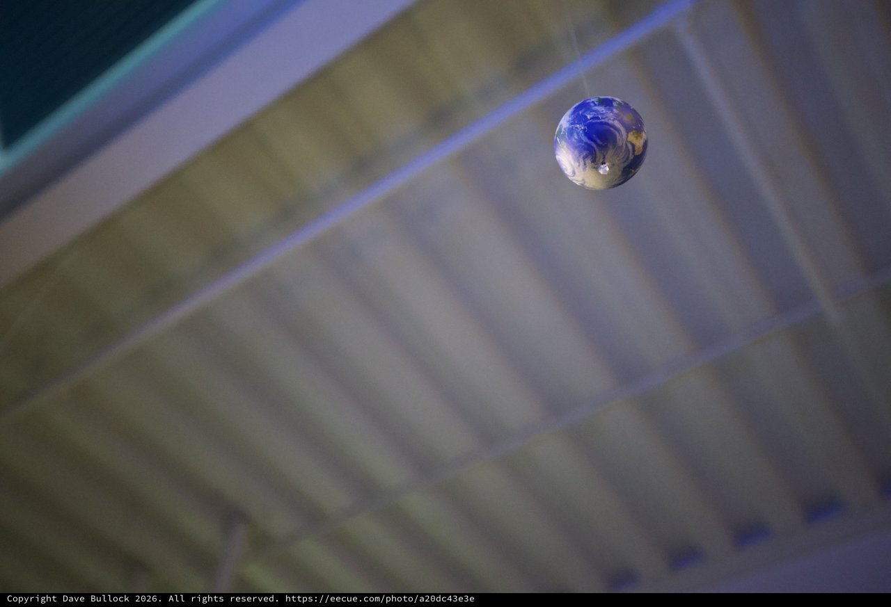 Earth Marble Suspended in Cosmic Blur