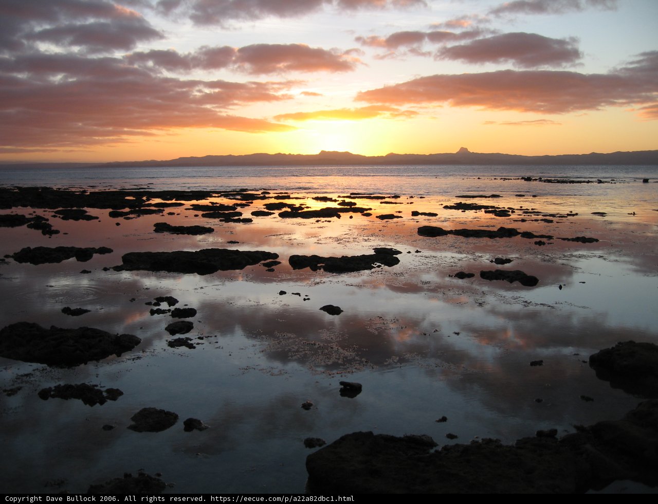 Majestic Sunset Over Rocky Shore