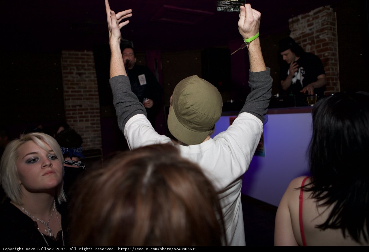 Urban Club-goer in White Shirt and Hat