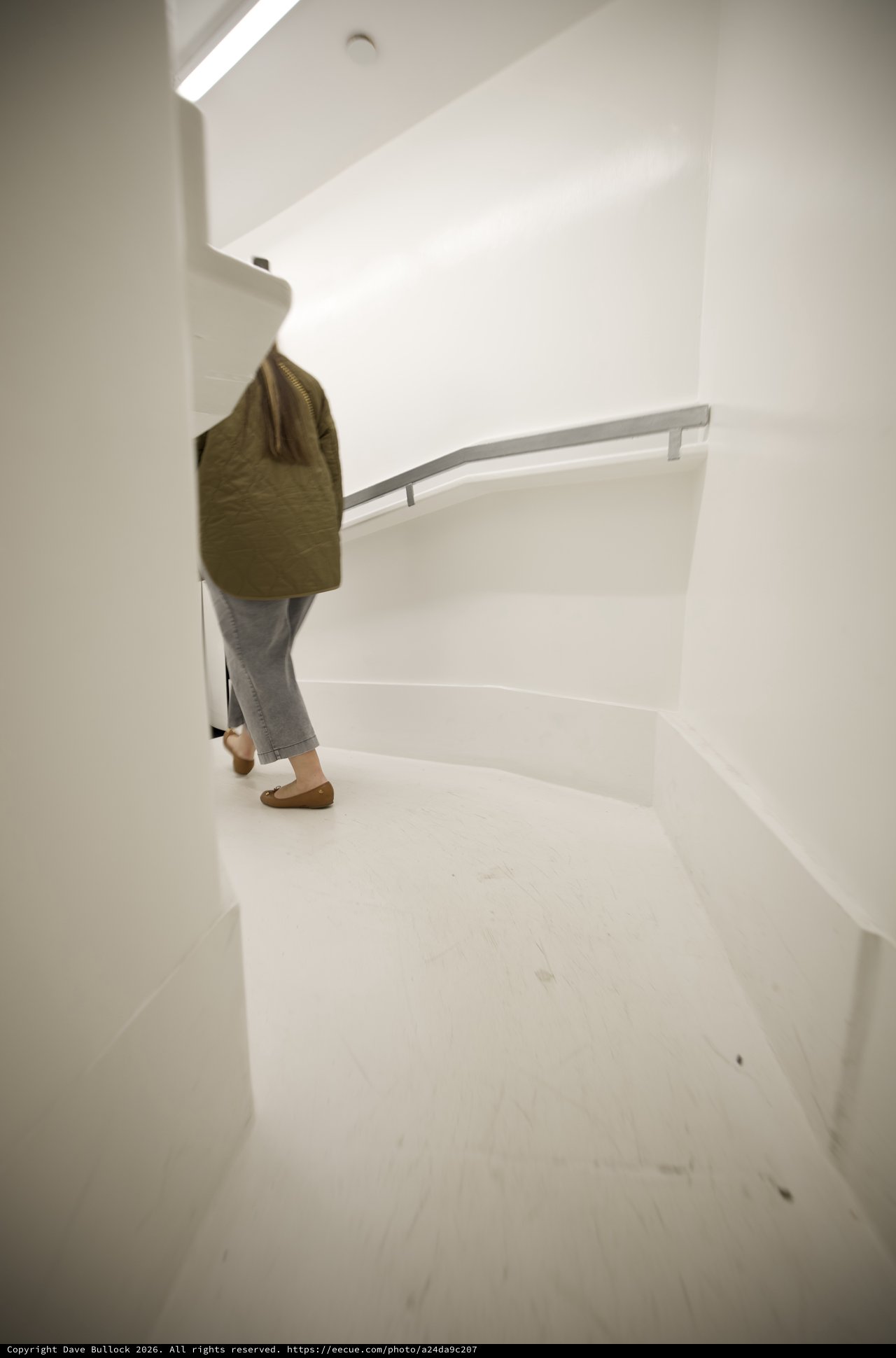 Ascending the Minimalist White Spiral Staircase
