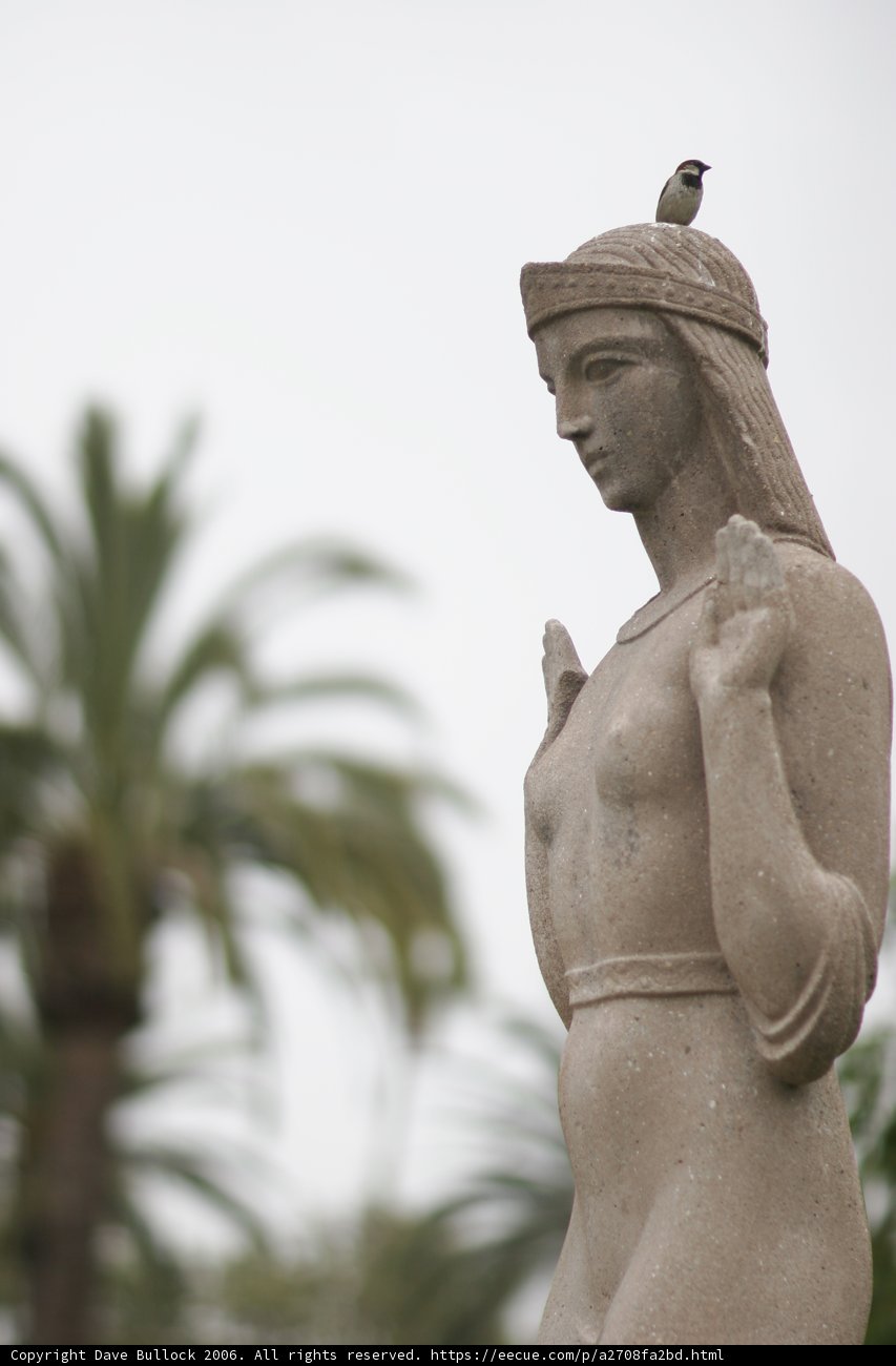 Woman with Bird Statue