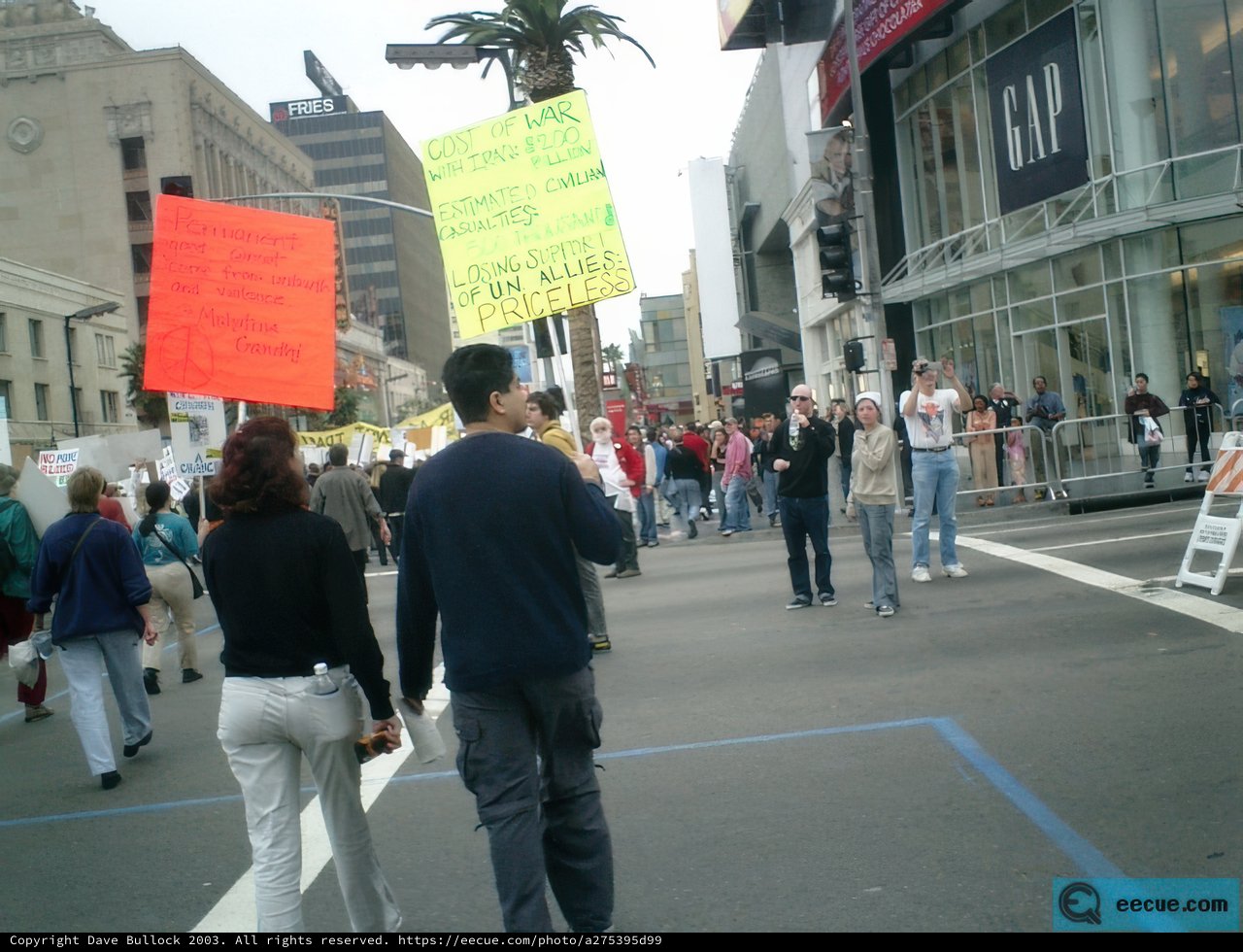 Protester Holds Up Sign in Urban Metropolis