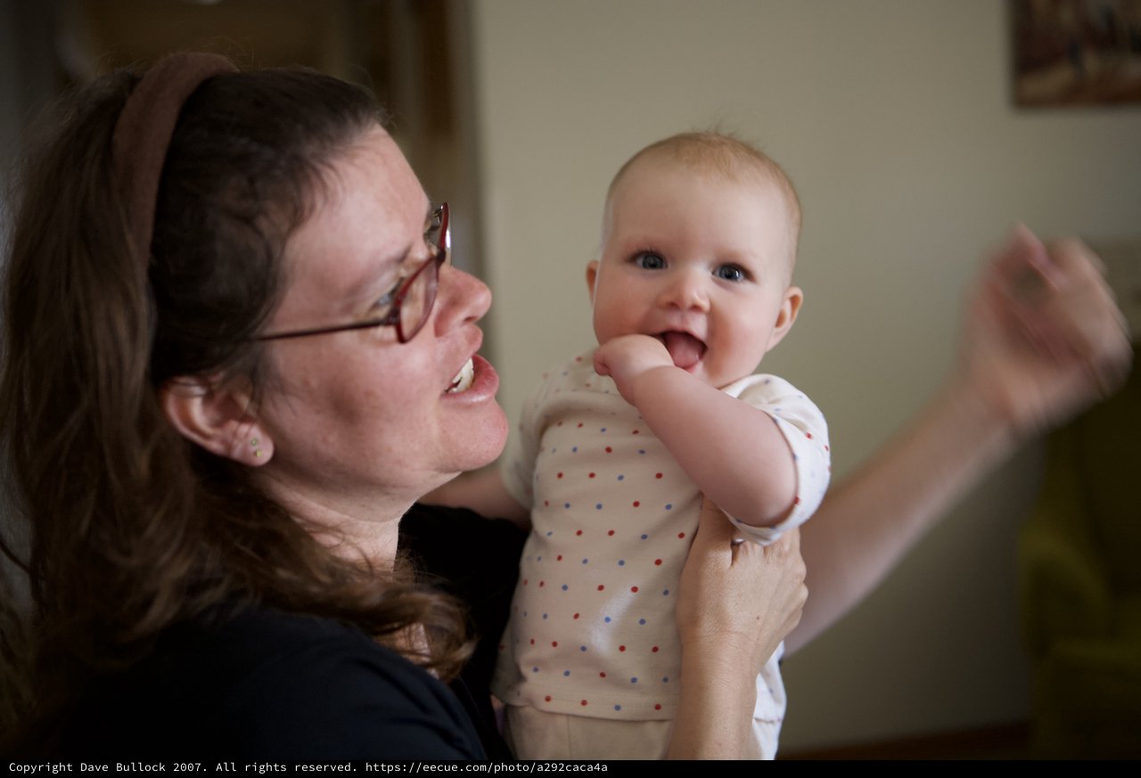 Joyful Mother and Baby Share Playful Indoor Moment
