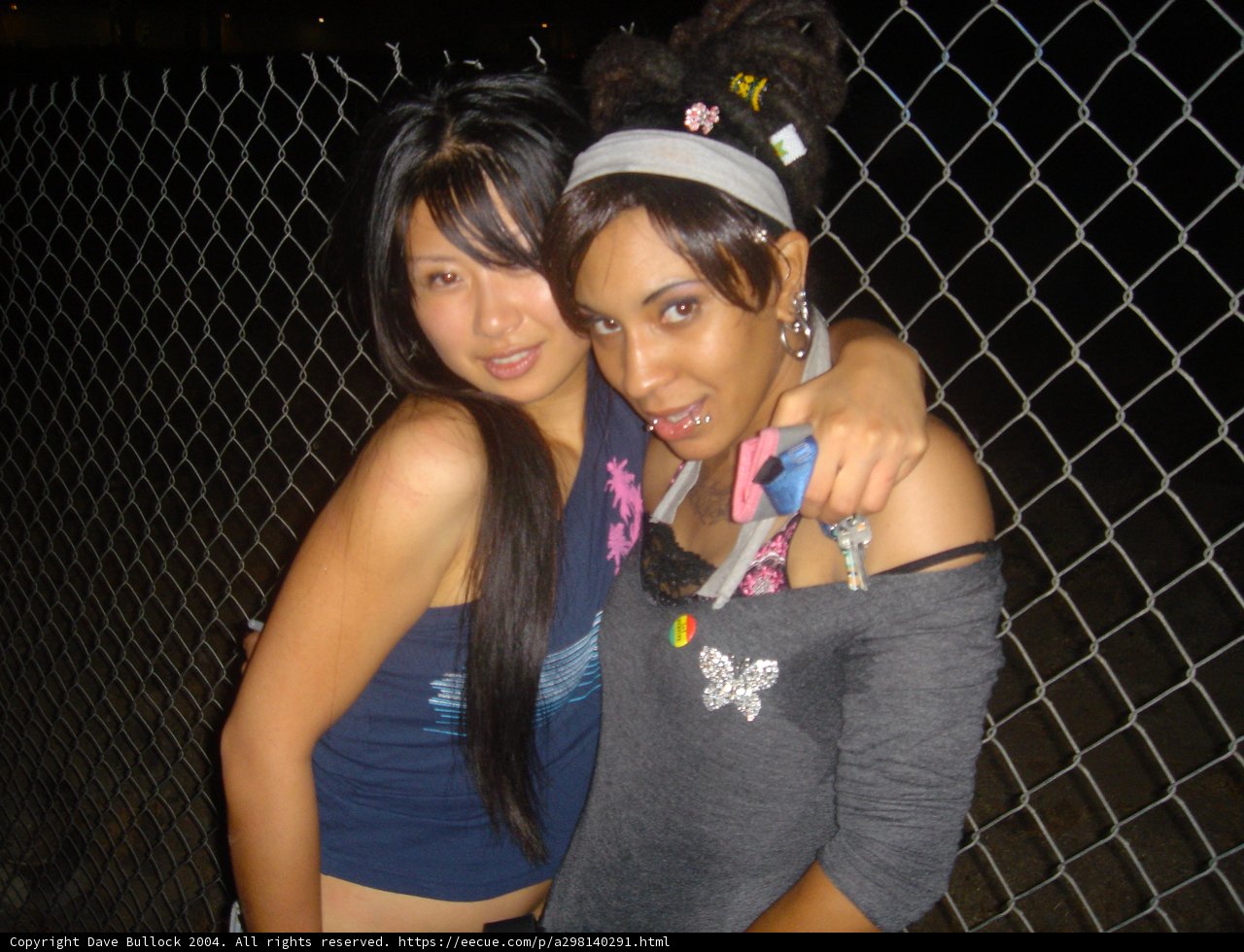 Two Women Smiling in Urban Tennis Outfits