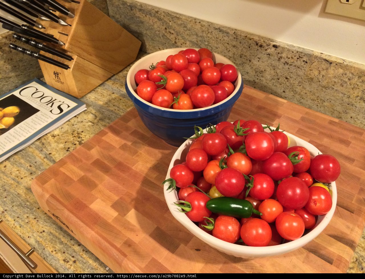 Fresh Tomatoes on Wooden Cutting Board