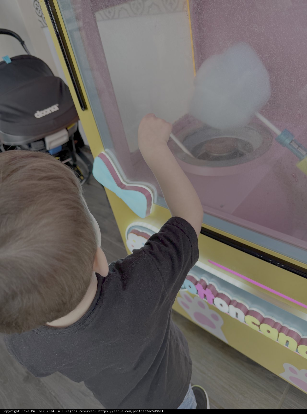 Child Playing Cotton Candy Arcade Game