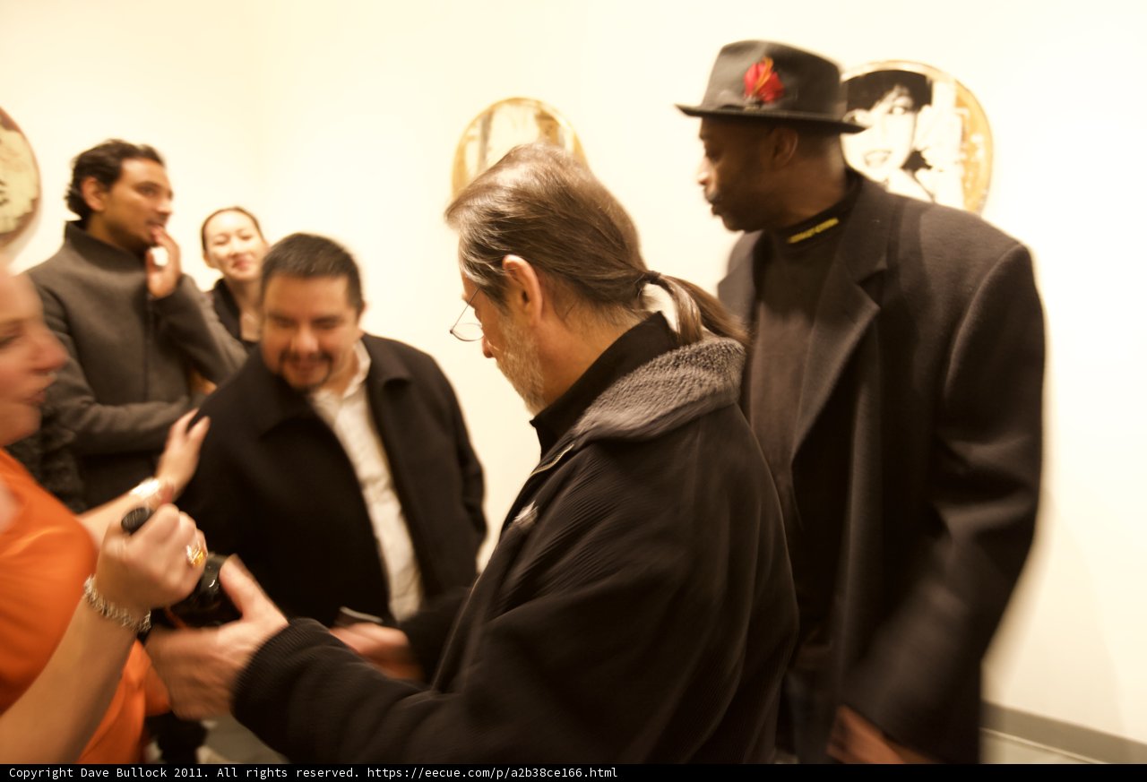 Black Coat, Baseball Cap, and Bling