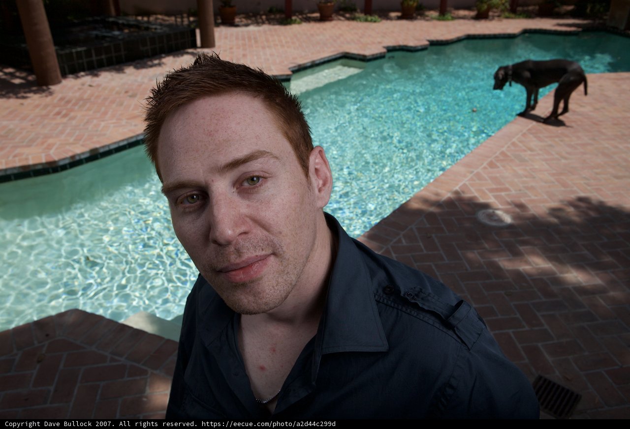 Man and Dog by the Flagstone Walkway