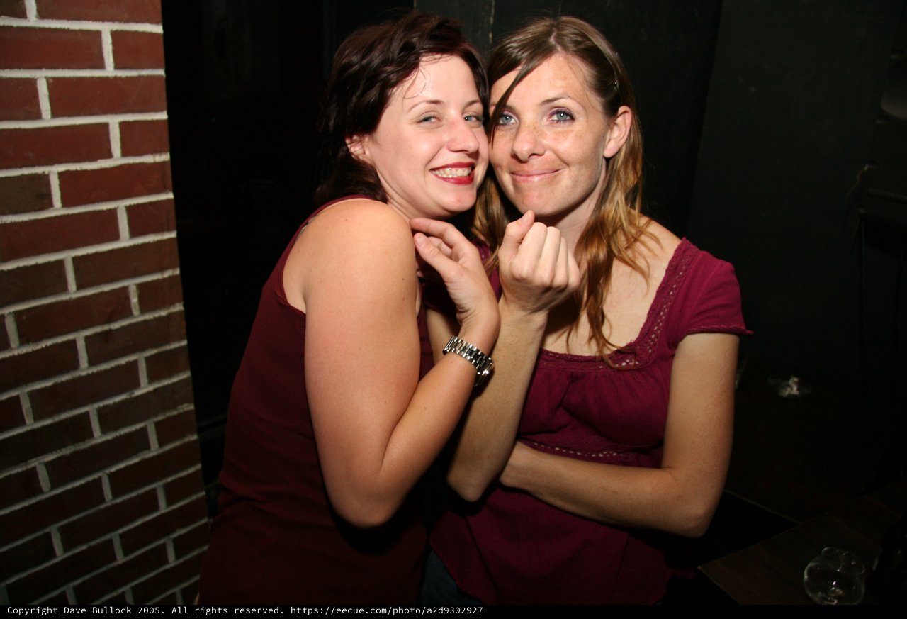 Two Friends Sharing a Joyful Moment at Night