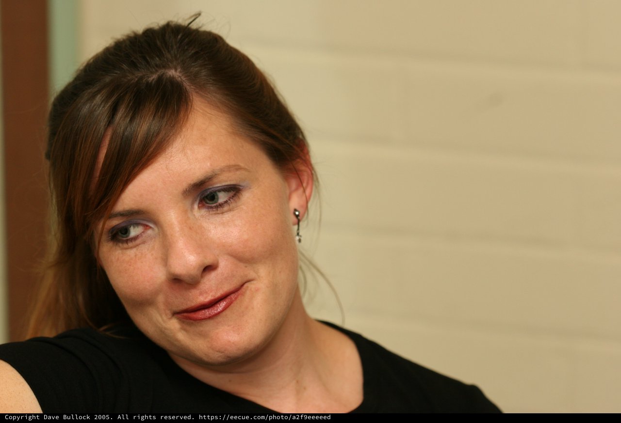 Candid Portrait of Woman in Thoughtful Smile