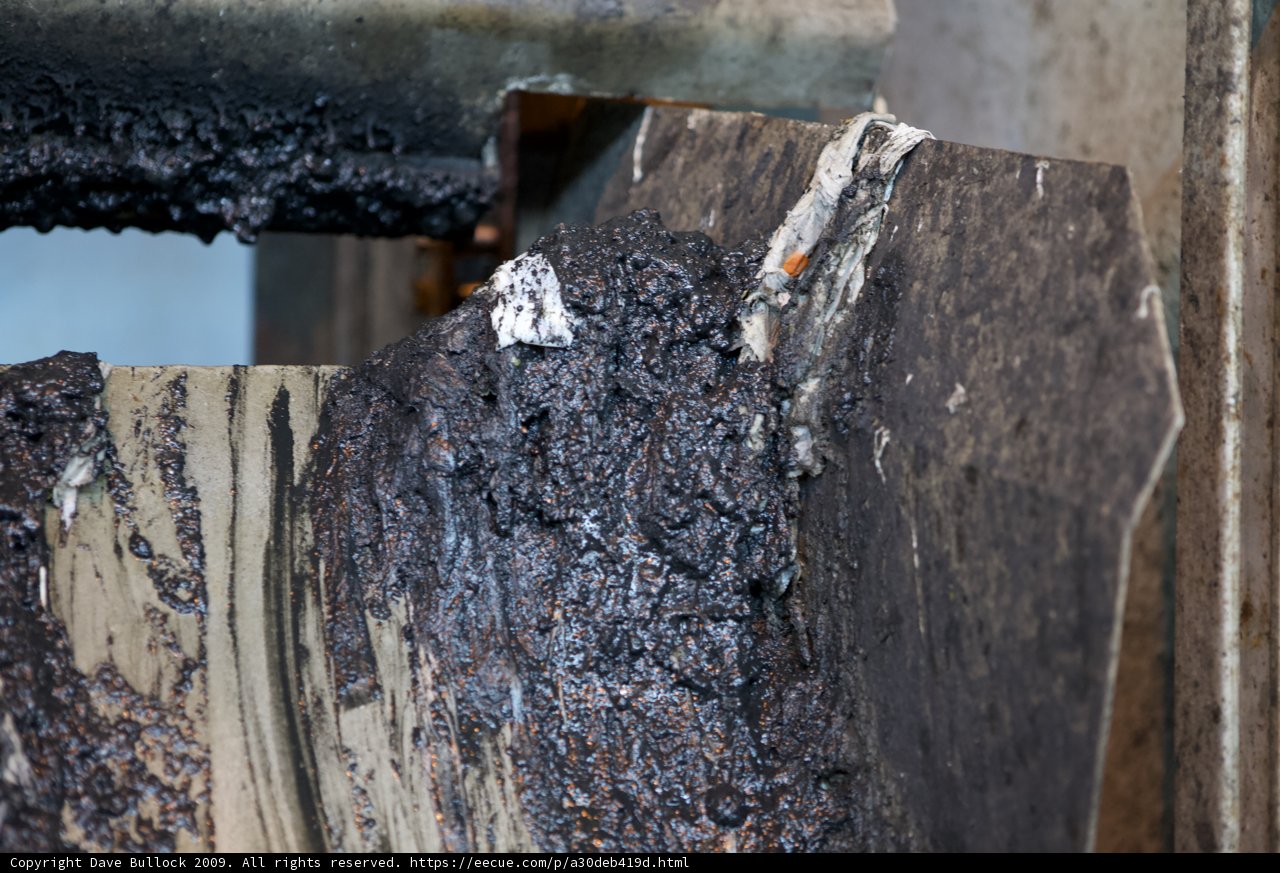 Rusty Tar-Coated Wood
