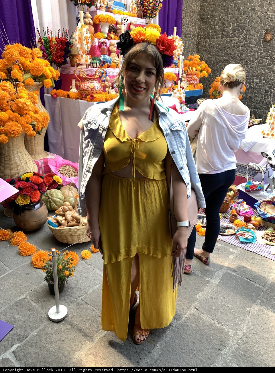 A Woman's Yellow Summer Dress and Flower Bouquet