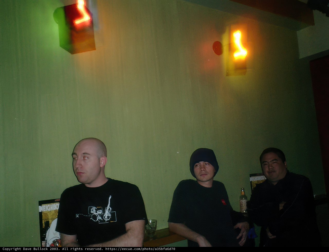 Three Men Enjoying a Drink at the Bar