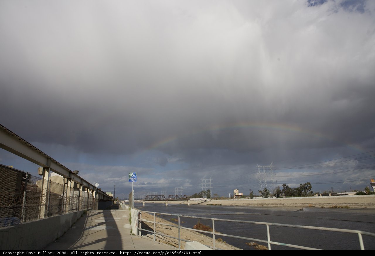 Vibrant Rainbow over the Roadway