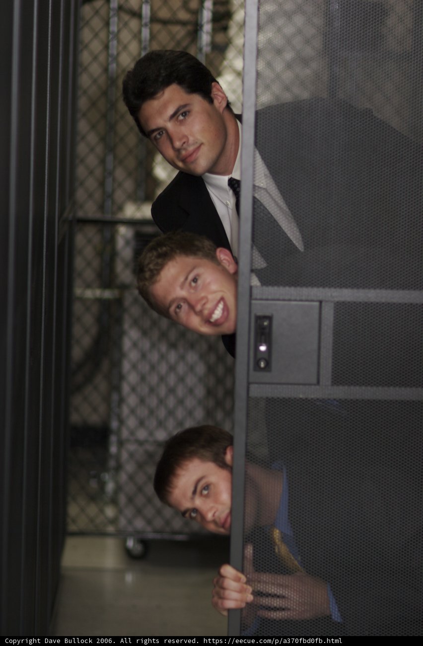 Three Men in Suits Ascending Staircase