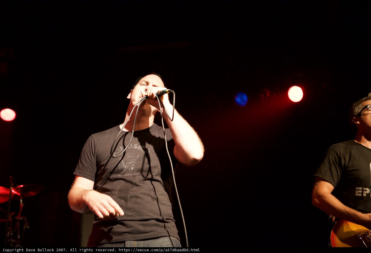 Rocking the Glasshouse: Two Men Perform on Stage