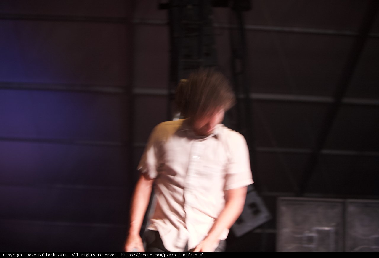 Blurry Man on Stage with Mic