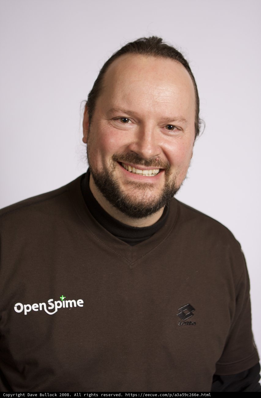 Smiling Man in Brown Shirt