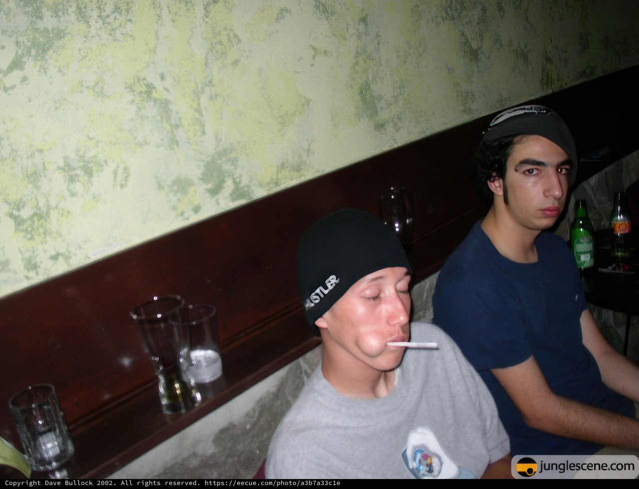 Two Men Enjoying a Drink at the Table