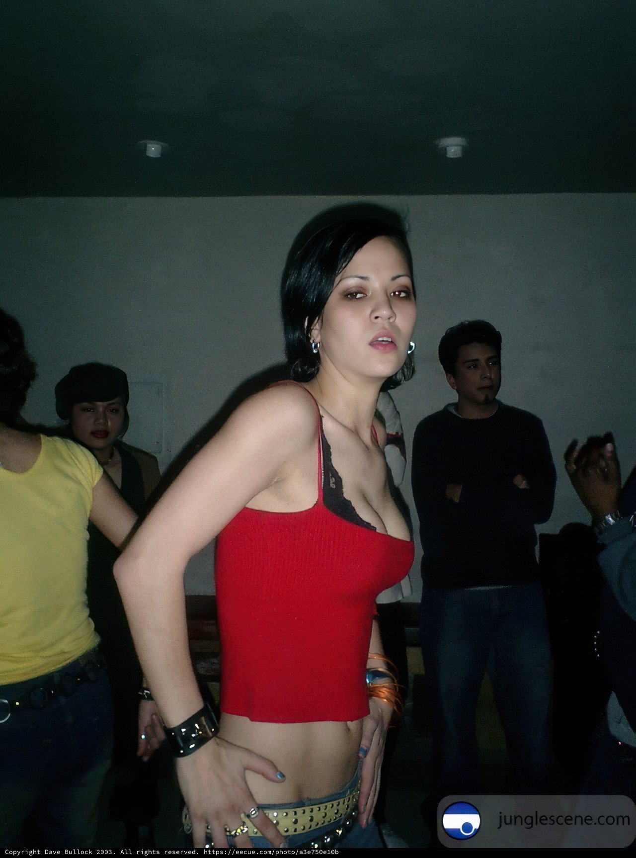 Woman in Red Standing Out in the Crowd