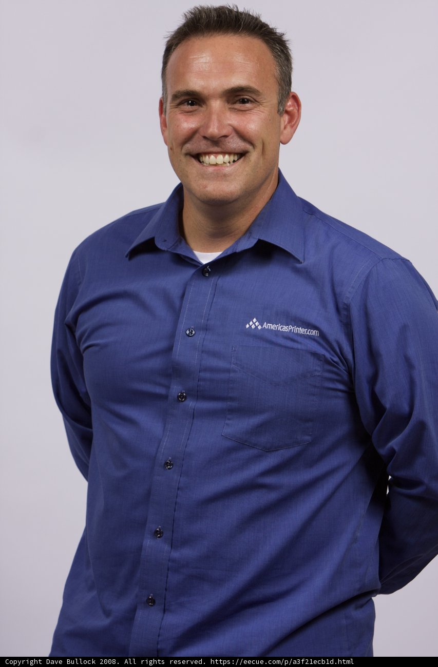 Blue Shirted Man with a Smile