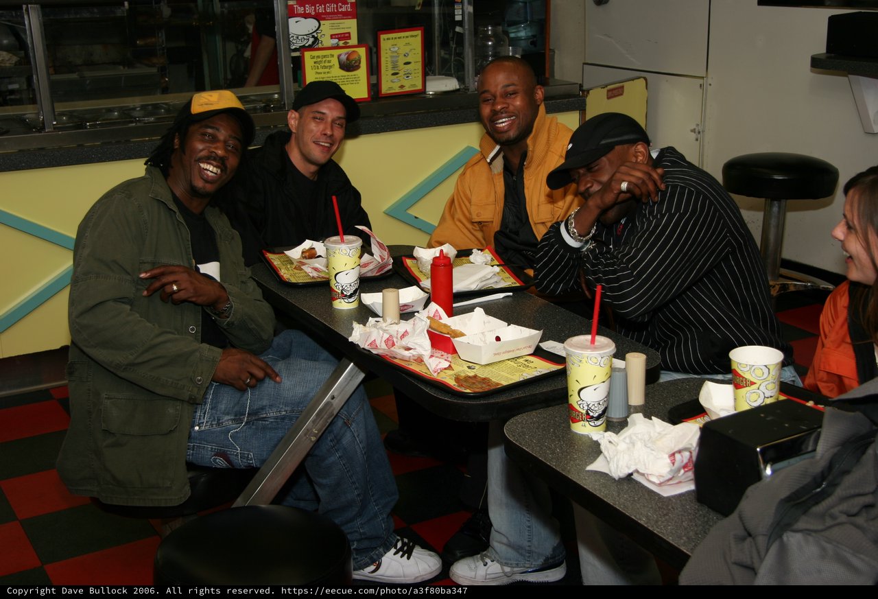 Friends Laughing Together at a Burger Joint